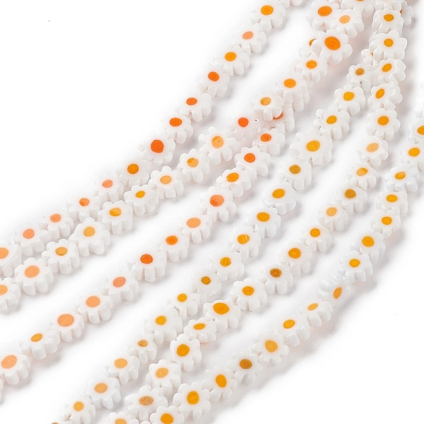 <p>Стеклянные бусины - цветочки ручной работы, выполнены в технике миллефиори (миллефьори). Бусины белого цвета с жёлтой серединкой, напоминают ромашки. У некоторых бусин не хватает лепестков. Оттенок может отличаться от фотографии и от партии к партии. Бусины могут существенно отличаться по форме и размеру. У бусин могут быть скошены лепестки. В низке около 26 бусин, низки формируются без проверки каждой бусины на дефекты. Цена за низку.
</p>