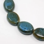 Бусина керамическая, 33х24х12мм, плоский овал, сине-зеленый с коричневыми крапинками, 2 шт. <p>
Крупная овальная керамическая бусина ручной работы. Бусина покрыта глазурью сине-зелено-коричневого цвета. Бусины могут немного отличаться по форме и размеру, рисунок на каждой бусине уникален. Диаметр отверстия - около 1.8 мм. Цена за 2 бусины.
</p>