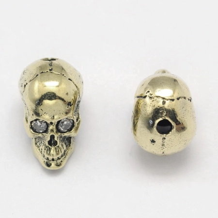 <p>Фурнитура для бижутерии Милано класса люкс (MILANO LUX). Качественный компонент для бижутерии - эффектная объемная бусина череп. Размер отверстия примерно 1.5 мм, длина бусины по отверстию - около 9 мм. Инкрустация кристально-прозрачными фианитами. Размер может немного отличаться от партии к партии. Оттенок может отличаться от фотографии. Цена за 1 шт.</p>