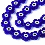 <p>Стеклянные бусины - цветочки ручной работы, выполнены в технике миллефиори (миллефьори). Бусины насыщенного синего цвета с бело-чёрной серединкой, напоминающей глаз. Иногда предметы с такими глазками используют как амулет от сглаза. Оттенок может отличаться от фотографии и от партии к партии. Бусины могут существенно отличаться по форме и размеру. В низке около 18 бусин, низки формируются без проверки каждой бусины на дефекты. Цена за низку.
</p>