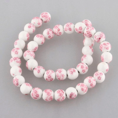 <p>Фарфоровая бусина (porcelain) с сиренево-розовыми цветами (печатный узор), оттенок может отличаться от фотографии. Рисунок может быть немного смазан (см. фото). Диаметр бусин - около 8 мм, диаметр отверстия - около 1.8 мм. Бусины могут немного отличаться по форме и размеру. Цена за низку, около 42 бусин.</p>