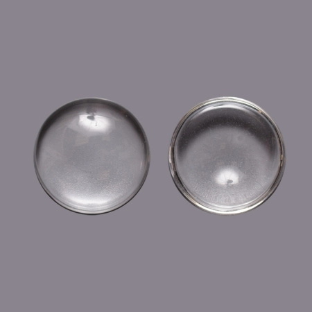 <p>
 Круглый стеклянный прозрачный кабошон, толщина 5-8 мм. Диаметр примерно 24,7 мм. Хорошо смотрится в рамке с подложенной под него картинкой или фотографией. На кабошонах возможны небольшие царапинки. Цена за упаковку 40-50 грамм в зависимости от толщины кабошонов (около 10 штук, фасуются без проверки на дефекты).
</p>