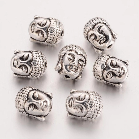 <p>
 Двусторонняя металлическая бусина - голова Будды. Стиль тибетское серебро. Оттенок может отличаться от фотографии и в разных поставках. Диаметр отверстия около 1.4 мм. Цена за 10 шт.
</p>