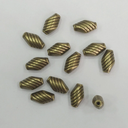 Бусина металлическая, 10х6х4.5мм, вытянутый ромб с насечками, базовый материал - цинковый сплав, бронзового цвета, 10 грамм