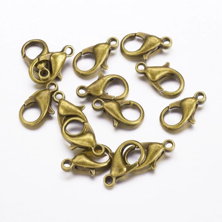 <p>Бюджетные застежки - карабины бронзового цвета. Диаметр отверстия петельки - около 1.5 мм. На покрытии могут быть небольшие пятнышки и вмятинки. Цена за 10 грамм (около 18 шт.). Застежки расфасованы без проверки на дефекты (обычно брак составляет не более 5%).</p>