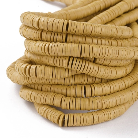 <p>Плоские круглые бусины - чипсы (диски, рондели heishi) ручной работы из полимерной глины (пластики). Бусины могут немного отличаться по форме и размеру. Оттенок может отличаться от фотографии. Бусины довольно мягкие, гибкие, напоминают каучук. Цвет: светло-коричневый (от горчичного до насыщенно бежевого в разных поставках). Цена за низку длиной около 43 см, около 350-400 бусин.</p>