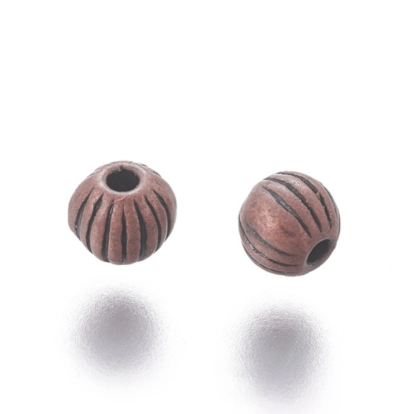 <p>Бусина - разделитель шарик с полосками, под античную медь. Оттенок может отличаться от фотографии. Диаметр отверстия около 1 мм. Цена за упаковку 10 грамм (около 65 бусин).</p>