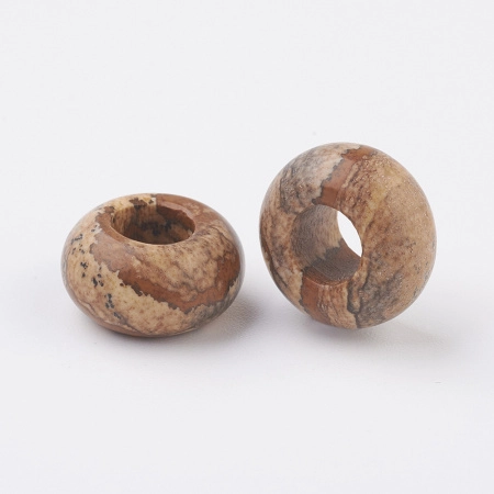 <p>Бусины - рондели с крупным отверстием (абакусы, диски) из натурального камня - песочной пейзажной яшмы. Диаметр отверстия около 6 мм. Эти бусины отлично подходят для браслетов в стиле Пандора, а также для сборки украшений с кожаными шнурами. Бусины могут немного отличаться по форме и размеру. Оттенок может отличаться от фотографии. Цена за 2 бусины.</p>