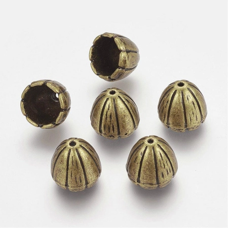 Конус, 10х9мм (внутренний размер 7мм), колокольчик, базовый материал - цинковый сплав, бронзового цвета с чернением, 1 шт. <p>Конус в форме цветка колокольчика, также напоминает тюльпан. Цвет - бронзовый с чернением. Можно использовать как обниматель, концевик для кисточки или бисерных жгутов и бижутерной сетки. Диаметр отверстий - 7 мм и 1 мм. Цена за 1 шт.</p>