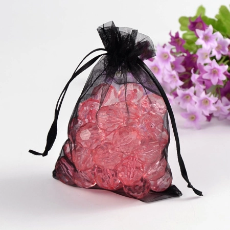 <p>Подарочный мешочек из чёрной органзы с черной ленточкой для завязывания, оттенок может отличаться от фотографии. Мешочки могут немного отличаться по форме и размеру, быть слегка помятыми. Цена за 10 шт.</p>