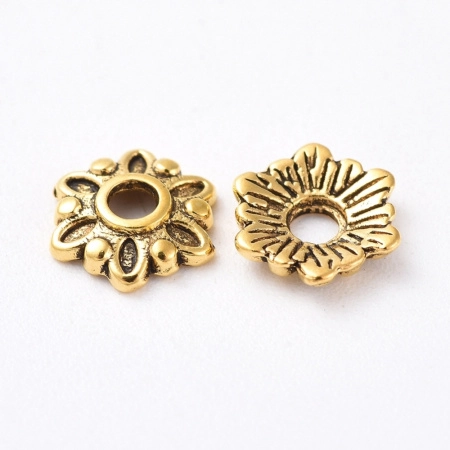 <p>Шапочка для бусин в форме стилизованного цветочка. Цвет золотистый с чернением, оттенок может отличаться от фотографии. Цена за 5 грамм (около 24 штук, фасуются без проверки на дефекты).</p>