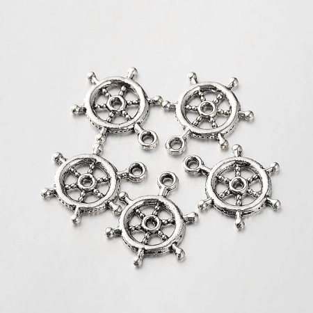 <p>Двусторонняя подвеска штурвал, стиль тибетское серебро. Базовый материал - бижутерный металлический сплав, покрытие серебристое с чернением. Оттенок может отличаться от фотографии и в разных поставках. На фотографии показана лицевая и тыльная стороны. Цена за 1 шт.</p>