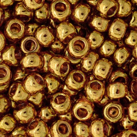 <p>Японский бисер TOHO Round (круглый Тохо), размер 6/0 (4 мм). Бисер золотого цвета, на просвет - розовый (Gold-Lustered Transparent Pink). Цена за 10 грамм (около 170 бисеринок).</p>