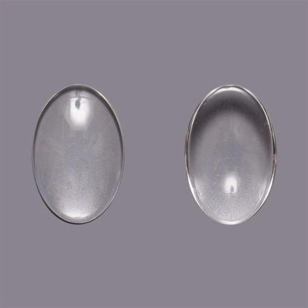 <p>
 Стеклянный прозрачный кабошон овальной формы, толщина около 5-6 мм. Кабошоны могут немного отличаться по форме и размеру. Хорошо смотрится в рамке с подложенной под него картинкой или фотографией. На поверхности кабошона могут встречаться небольшие царапины или потертости. Цена за 40 грамм (около 10 кабошонов, фасуются на вес без проверки на дефекты).
</p>