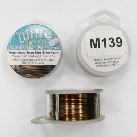 <p>Качественная не темнеющая бронзовая проволока для создания украшений и других видов рукоделия. Марка Wire elements (ребрендинг марки Craft Wire pro-quality), цвет винтажная бронза, устойчивая к потемнению (VINTAGE BRONZE tarnish-resistant). Оттенок может отличаться от фотографии. Базовый материал - медь. Толщина 22 gauge (около 0,644 мм). Произведена в Пакистане для американской компании Bead Smith. Намотка может состоять из нескольких частей. Цена за катушку 15 ярдов (около 13.7 метров).</p>