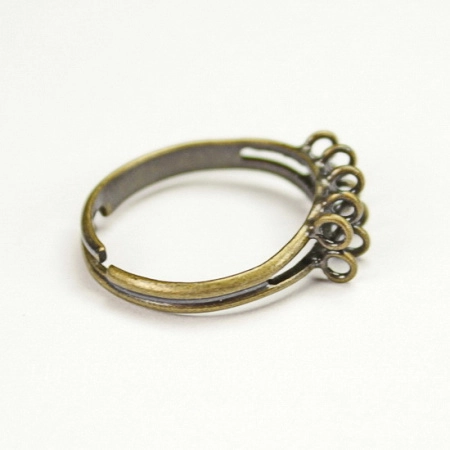 <p>Двойная основа для кольца с 10 (десятью) петельками, бронзового цвета. Не содержит никель. Размер регулируется. Цена за 5 шт.</p>