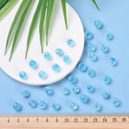 Бусина лэмпворк, 8мм, прозрачная с голубой сердцевиной и белыми крапинками, светящаяся в темноте, 10 шт. <p>Бусины ручной работы из прозрачного стекла с голубой сердцевиной и белыми крапинками внутри. В темноте бусины светятся зеленоватым светом. Выполнены в технике лэмпворк (лампворк, lampwork). Могут немного отличаться по форме и размеру. Бусины могут быть покрыты белым налетом - пылью из отверстия, которая легко стирается. Оттенок может отличаться от фотографии и в разных поставках. Цена за 10 бусин.</p>