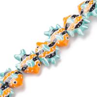 Бусина фарфоровая, 25х20х10-20х16х5мм, тропическая рыбка, бирюзово-оранжевая с чёрным, 1 шт.