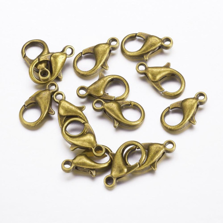<p>Бюджетные застежки - карабины бронзового цвета. Диаметр отверстия петельки - около 1.5 мм. На покрытии могут быть небольшие пятнышки и вмятинки. Цена за 10 грамм (около 18 шт.). Застежки расфасованы без проверки на дефекты (обычно брак составляет не более 5%).</p>