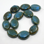 <p>
Крупная овальная керамическая бусина ручной работы. Бусина покрыта глазурью сине-зелено-коричневого цвета. Бусины могут немного отличаться по форме и размеру, рисунок на каждой бусине уникален. Диаметр отверстия - около 1.8 мм. Цена за 2 бусины.
</p>