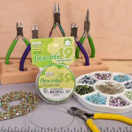 <p>Профессиональный ювелирный тросик Flex-Rite с нейлоновым покрытием. 49-жильный тросик премиум-класса. Цвет стальной (темно-серебристый). Оттенок может отличаться от фотографии и в разных поставках. Цена за катушку 30 футов (9.14 метра).</p>